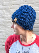 Load image into Gallery viewer, Fossil Beanie in dark blue with no pom.  It is shown here on a model.
