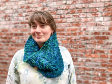Load image into Gallery viewer, Fossil Cowl in teal shown on a model wearing a white sweatshirt against a brick wall
