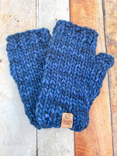 Load image into Gallery viewer, T Rex Mitts in dark blue in a flat lay against a wooden background.
