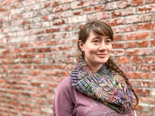 Load image into Gallery viewer, Fossil Cowl in rainbow shown on a model wearing a purple shirt against a brick wall
