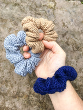 Load image into Gallery viewer, The Cotton Scrunchy is a simple knit hair accessory.  They are shown here on a model&#39;s wrist like a bracelet.
