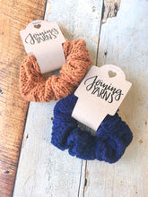 Load image into Gallery viewer, 2 cotton scrunchies in copper and navy shown in a flat lay.
