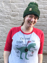 Load image into Gallery viewer, The Hadrosaur Hat is a lightweight, double layered slouchy beanie with folded brim. It is shown here in green/blue on a model.
