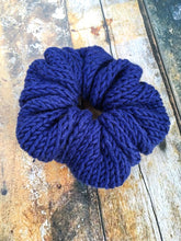 Load image into Gallery viewer, The Cotton Scrunchy is a simple knit hair accessory. It is show here in navy in a flat lay.

