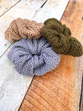 Load image into Gallery viewer, Three scrunchies in a flat lay.  The bottom scrunchie is gray with a light brown and olive scrunchies on top.
